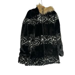 Woman Within Black and White Patterned Teddy Jacket